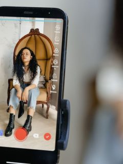 featured phone screen view of girl recording herself on TikTok