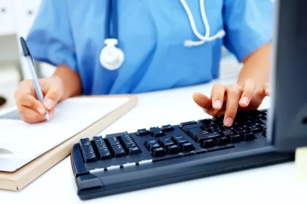 Image that represents a keyboard and a nurse working
