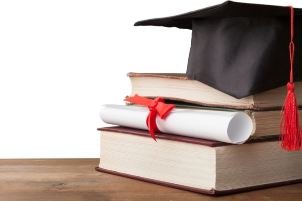 A image with a graduation cap and nursing books