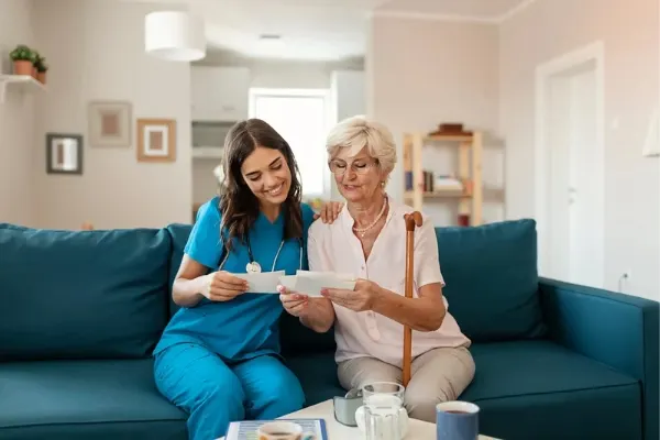 A nurse communicating with a elderly patient