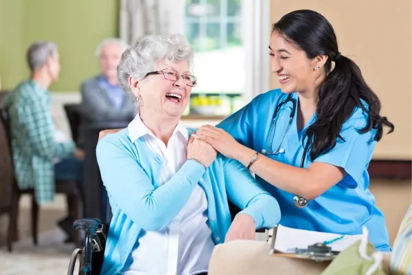 A nurse interacting with a elderly patient