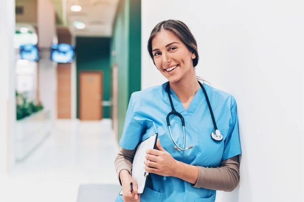 nurse at hospital with stethoscope and clipboard 