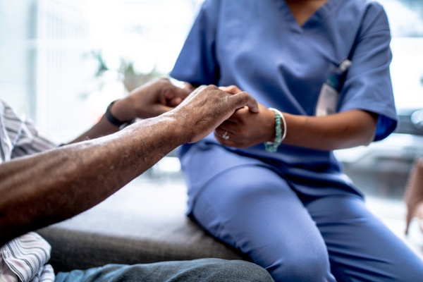 nurse holding hand of patient