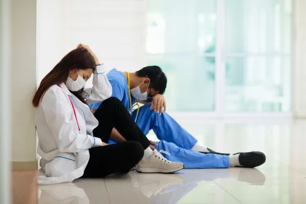 Tired nurses taking a break out of the ICU emphasizing wellness among nurses
