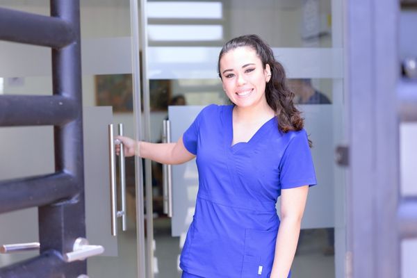 nursing student in blue scrubs