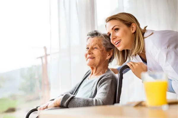 Nurse communicating with a elderly patient