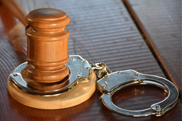 A image representing hand cuffs and court gavel for convicted nurse 