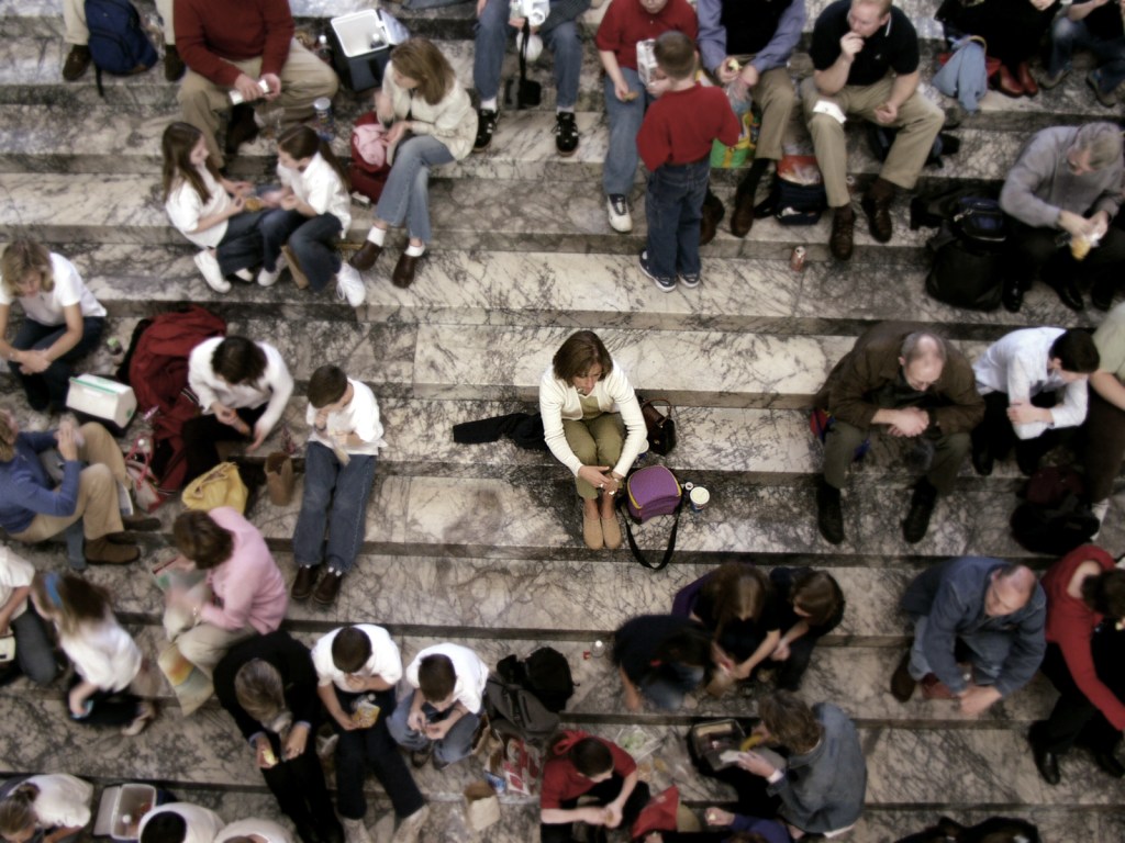 community of people sitting on stairs